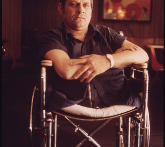 Jack Smith, 42, Rhodell, West Virginia, Seated in the Beer Joint He Operates in a Wheel-Chair Purchased for Him by His Friend Arnold Miller, President of the United Mine Workers Union…04/1974 Jack Smith, 42, Rhodell, West Virginia, Seated in the Beer Joint He Operates in a Wheel-Chair Purchased for Him by His Friend Arnold Miller, President of the United Mine Workers Union…04/1974