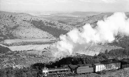 South African Railways steam locomotive class 19D No 2756 on a down mixed to Grahamstown near Goodwins Kloof, Cape Province, South Africa.